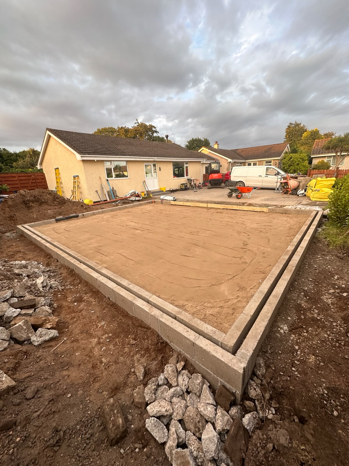 Blockwork substructure built up and the slab bed formed, edged and prepared for the reinforced concrete floor, Isle of Man
